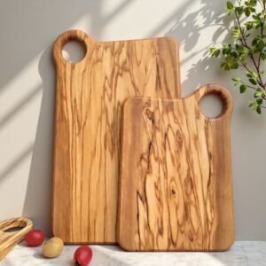 Handcrafted olivewood cutting board with handle, ideal for serving cheese or charcuterie