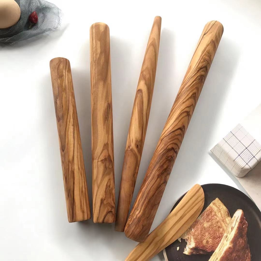 Solid olive wood rolling pin for baking, tapered design for pastry and dumplings, non-stick wooden baking tool.