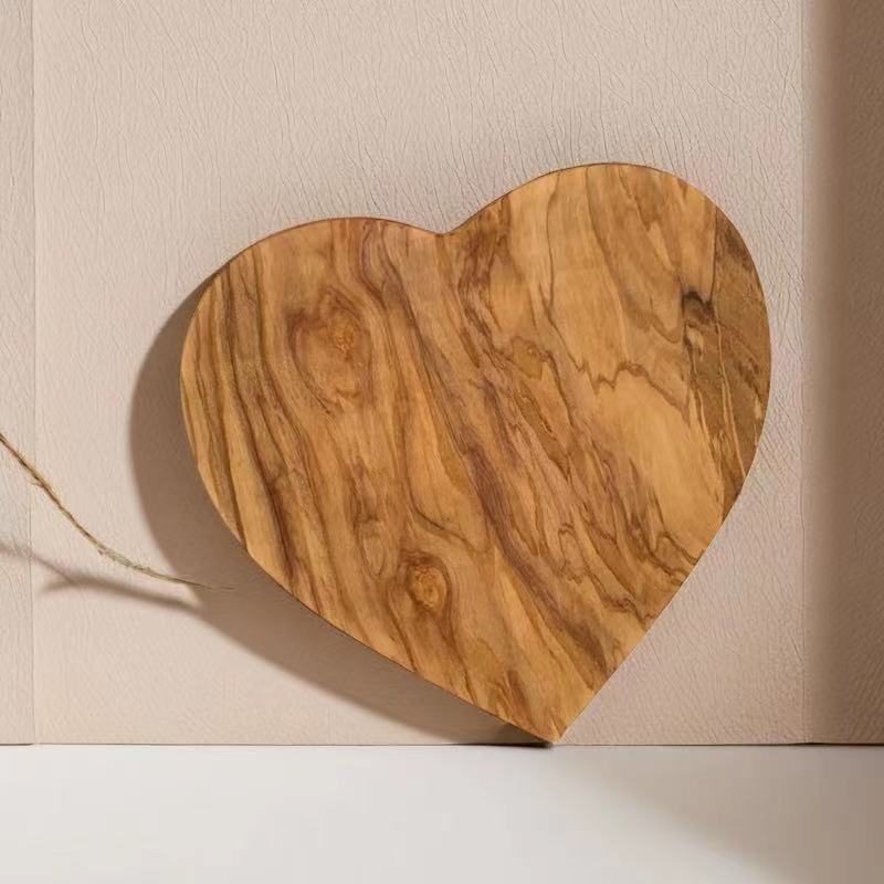 olivewood heart board andcrafted heart-shaped olive wood serving board with natural grain